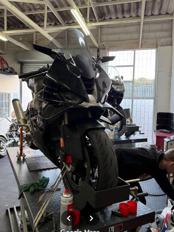 BMW motorcycle being worked on inside the workshop
